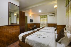 Un pat sau paturi într-o cameră la Hotel Sekai