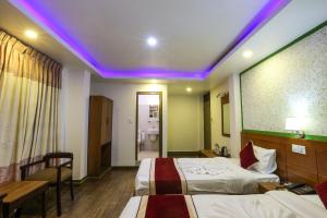 Un pat sau paturi într-o cameră la Hotel Sekai