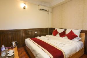 Un pat sau paturi într-o cameră la Hotel Sekai