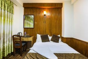 Un pat sau paturi într-o cameră la Hotel Sekai