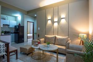 a living room with a couch and a table at BedChambers Serviced Apartment, Medicity in Gurgaon