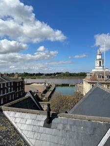 a view of a city with a river and a building at The Penthouse at Purfleet in King's Lynn
