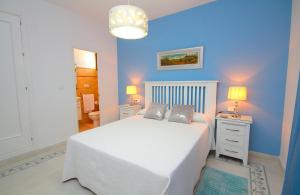 En eller flere senge i et værelse på Chalet Los 20 Pilares + 7 billeder