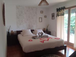 Postel nebo postele na pokoji v ubytování Chambre d'hôte Amouratcha