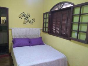 Ein Bett oder Betten in einem Zimmer der Unterkunft Pousada Quiosque do Professor