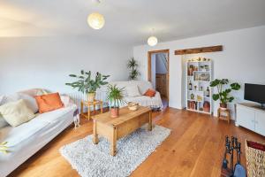 a living room with a couch and a coffee table at Host & Stay - Coast Farm Cottage in Marske-by-the-Sea