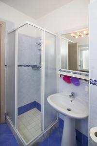 a bathroom with a shower and a sink at La Turrita Apartments in Ischia