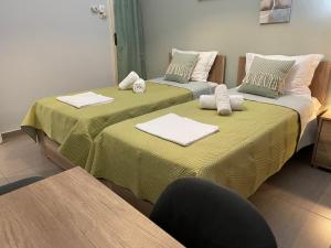 Posteľ alebo postele v izbe v ubytovaní Skiathos home