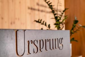 a sign with the name of a restaurant at Aparthotel Ursprung in Schladming