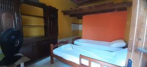 Postel nebo postele na pokoji v ubytování ROSÁRIO TEMPORADA Hostel