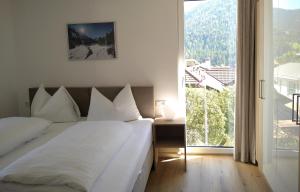 Voodi või voodid majutusasutuse Appartements am Kirchplatz toas