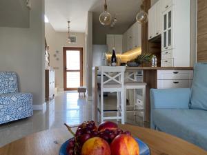 a bowl of fruit on a table in a kitchen at Villa Lavanda Golf in Balchik