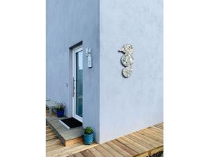 a facade of a house with a number eight on it at Ferienwohnung-Seepferdchen-Finnlandring in Timmendorfer Strand