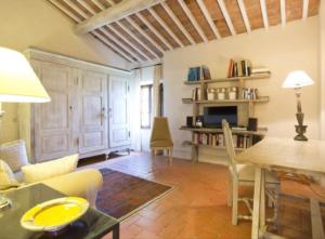a living room with a couch and a table at PodereVicoBasso Siena in Siena