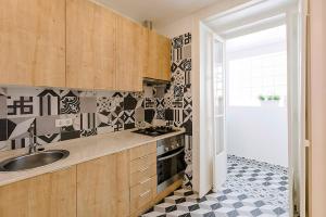 a kitchen with a sink and a stove at BELEM PLACE - free parking area in Lisbon