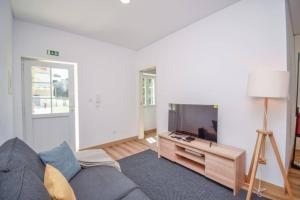 Posezení v ubytování Acolhedor Apartamento de 1 Quarto com Terraço