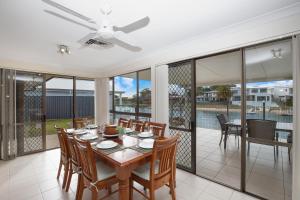 a dining room with a table and chairs at Hibbard 12 in Port Macquarie