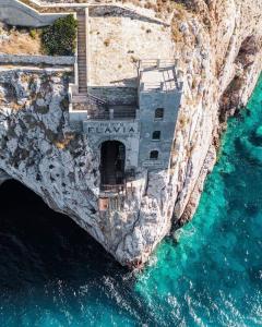 an aerial view of a building on a cliff over the water at Il Giardino di Giò in Iglesias