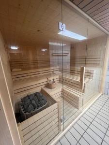a inside of a sauna with a glass wall at Esclusivo bilocale centralissimo in St. Moritz
