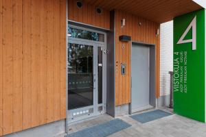 an entrance to a building with a glass door at Tower Cabin in Tampere