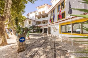 a street in front of a building at Clube do Lago Hotel in Estoril