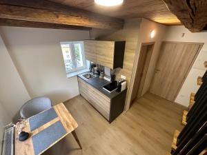a small kitchen with a sink and a counter at Lady Apartments in Liberec