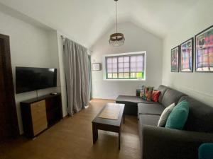 A television and/or entertainment centre at Bungalows Playa Flor, Campo Internacional, Maspalomas.
