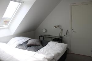Postel nebo postele na pokoji v ubytování Kærskovgård ferielejligheder