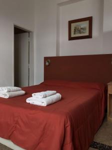 En eller flere senger på et rom på Civitella Appart