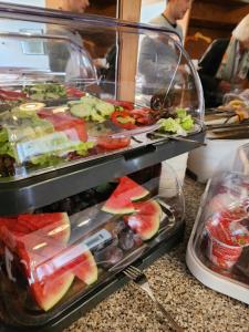 a display case filled with different types of fruit at Landhotel & Gaststuben Zum Hasen in Bad Saulgau +8 photos