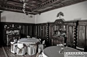 a black and white photo of a room with tables and chairs at Agroturystyka "Pałac w Janowie" in Janów