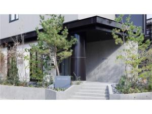 a building with stairs and trees in front of it at SOKI KANAZAWA - Vacation STAY 40333v in Kanazawa