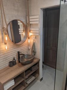 a bathroom with a sink and a mirror at Ó 38 Luxe Loft in Budapest
