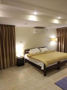 a hotel room with a bed and a window at Cairo international Scout House in Cairo