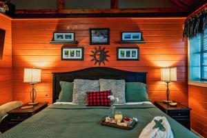a bedroom with a bed in a wooden wall at Lazy Fox Hideout in Sevierville