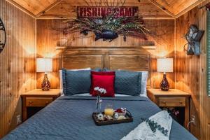 a bedroom with a bed with a tray of food on it at Lazy Fox Hideout in Sevierville