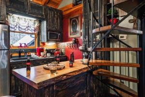 a kitchen with a wooden counter in a room at Lazy Fox Hideout in Sevierville