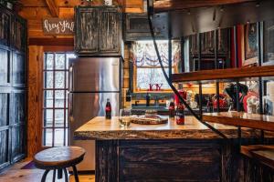 a kitchen with a counter and a refrigerator at Lazy Fox Hideout in Sevierville