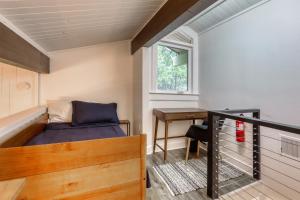 a small bedroom with a bed and a desk at Inviting Tahoe Escape in Incline Village