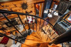an overhead view of a spiral staircase in a house with an umbrella at Lazy Fox Hideout in Sevierville