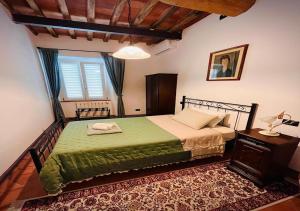 Postel nebo postele na pokoji v ubytování B&B Giardino delle Camelie