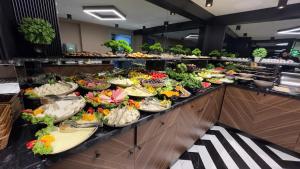 a buffet line with many different plates of food at THE PARK HOTEL in Istanbul