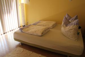 Postel nebo postele na pokoji v ubytování Mandarin Wellness Apartman