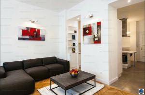 a living room with a couch and a table at Downtown Dimond in Budapest