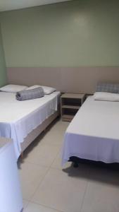 Cama ou camas em um quarto em Pousada Falls Park