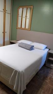 Cama ou camas em um quarto em Pousada Falls Park