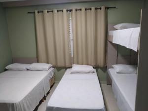Cama ou camas em um quarto em Pousada Falls Park