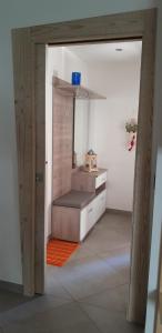 a room with a bed in the middle of a room at Casa vacanze Maria in Tesero