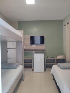 Cama ou camas em um quarto em Pousada Falls Park