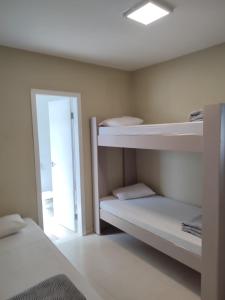 Cama ou camas em um quarto em Pousada Falls Park